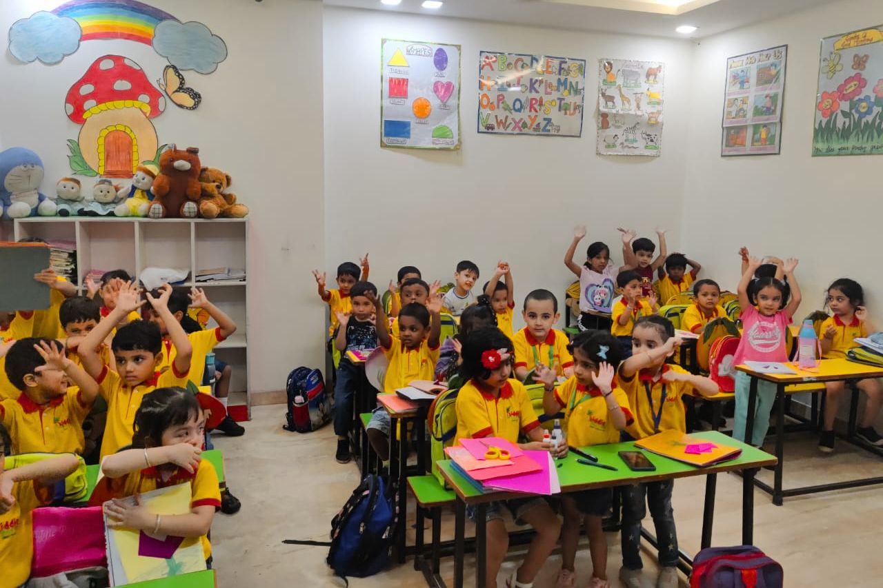 Children learning happily through the play-way method at Kiddie Farms School